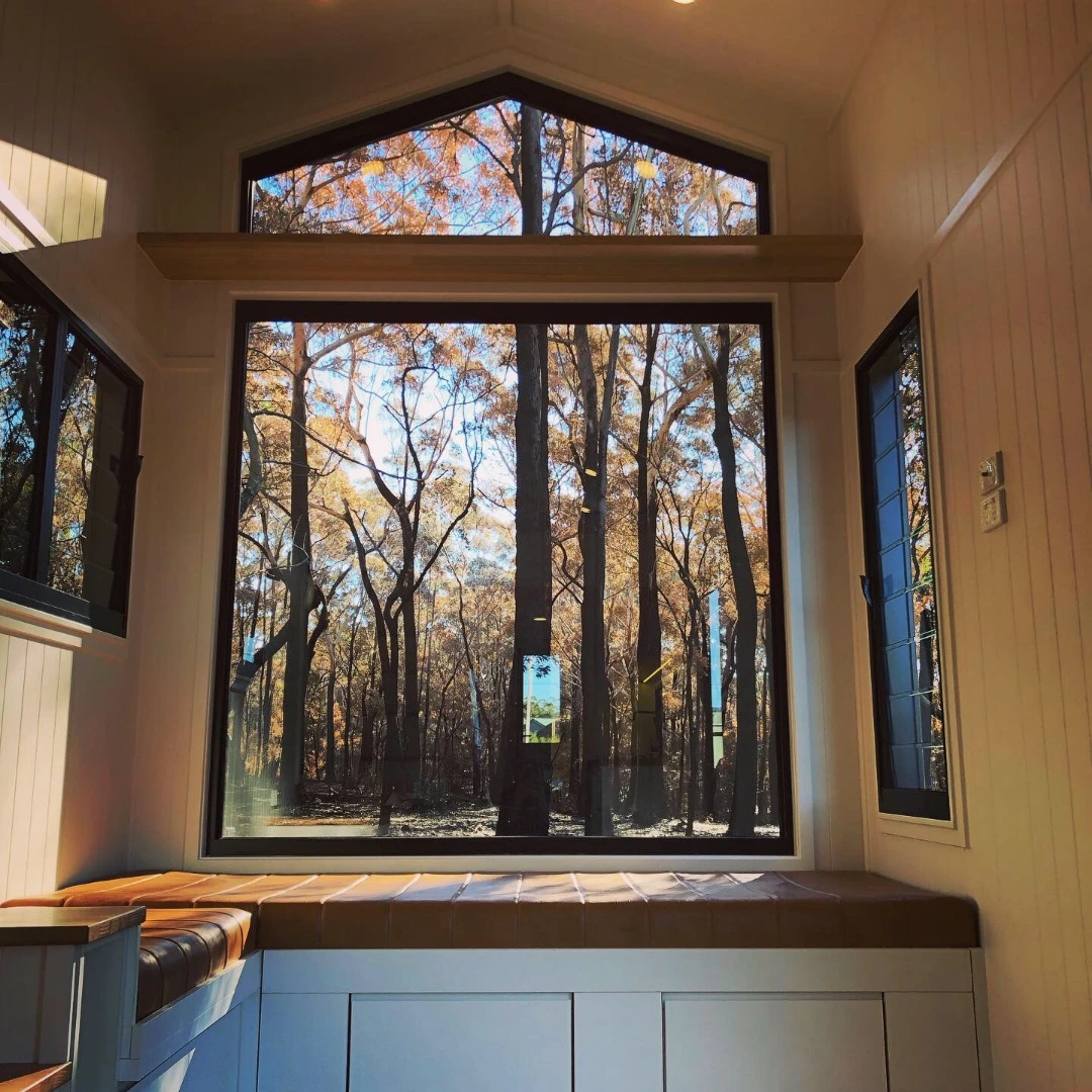 The window wall is made up of a large square window with a smaller triangle on top