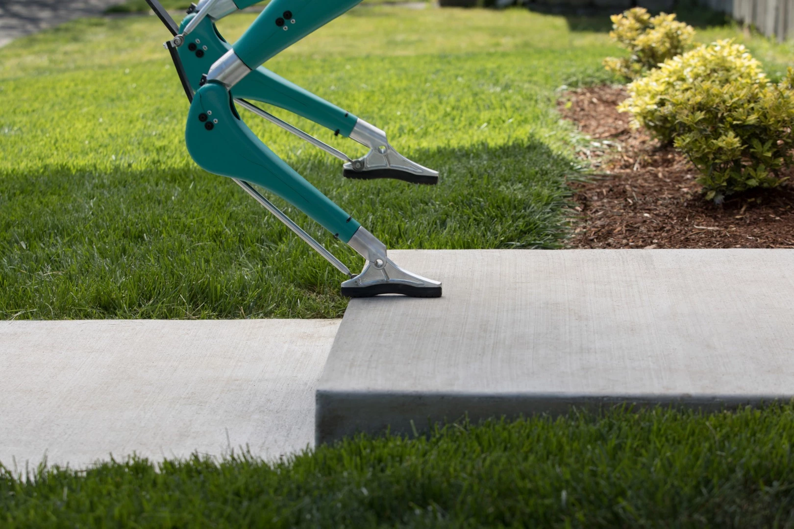 Digit can walk over uneven terrain and navigate obstacles, and can walk up and down steps