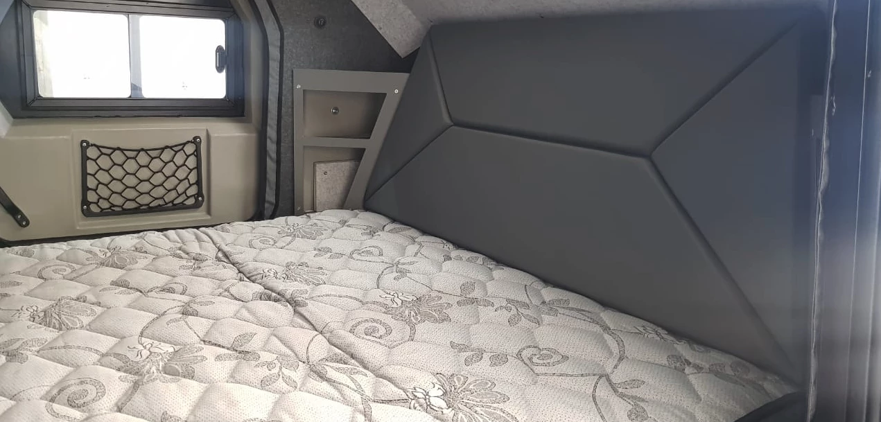 The Edgeout interior includes a 5.5-in-thick queen-size mattress