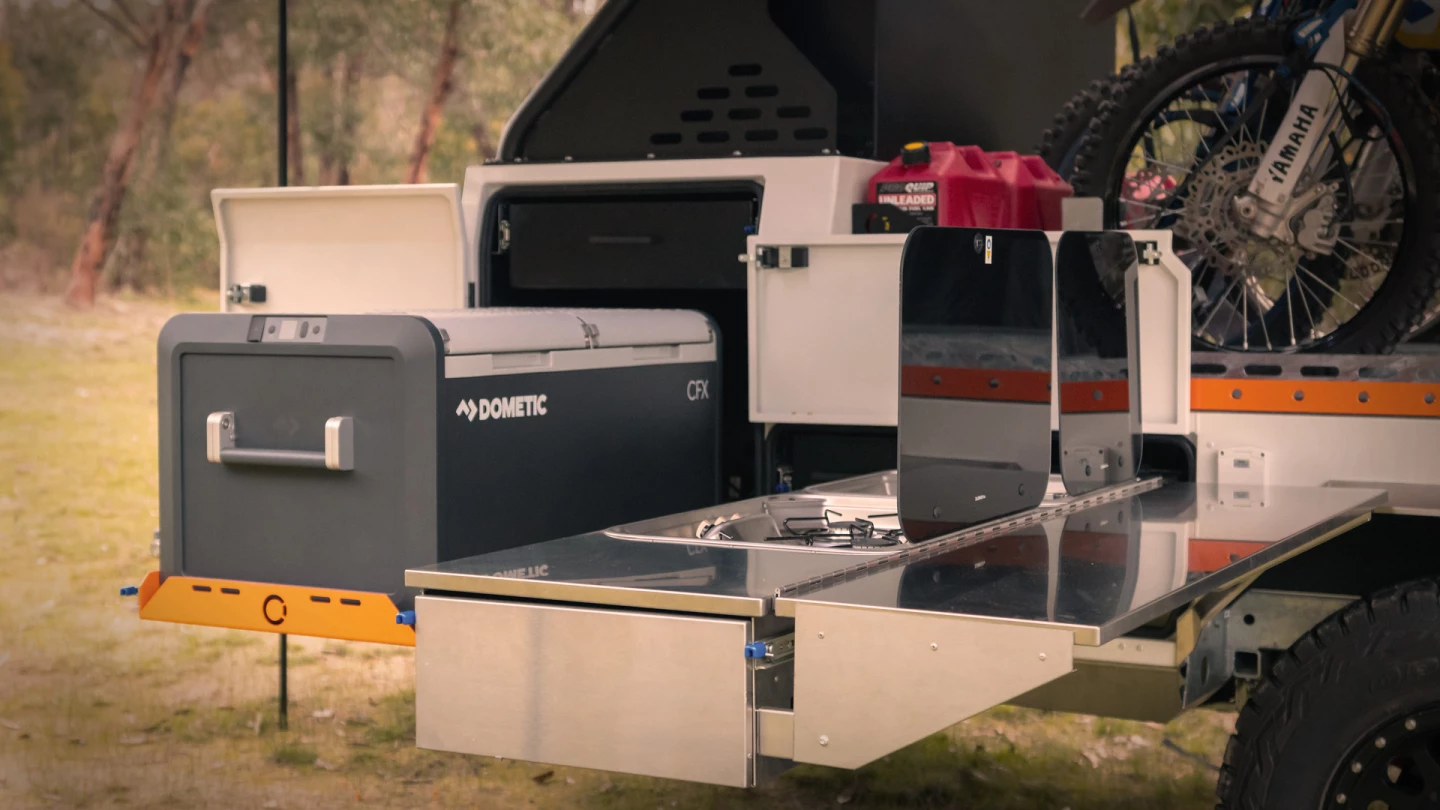 The Ryder shares its kitchen design with Offline's more dedicated camper trailers, combining a cooking slide with a separate fridge slide