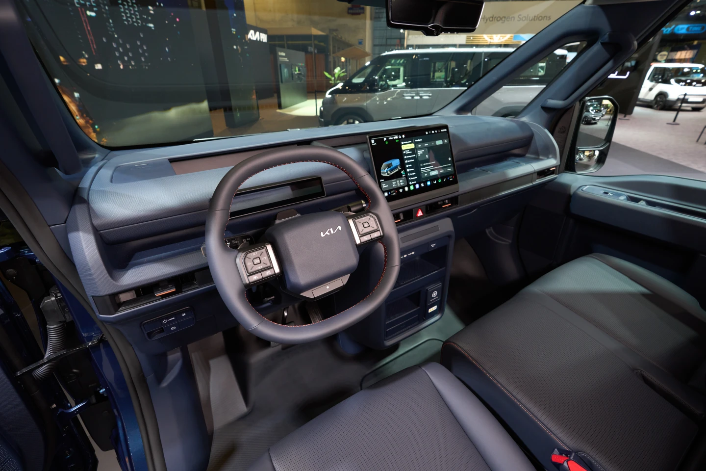 Kia augments the slim instrument panel with available 12.9- and 14.6-in infotainment displays