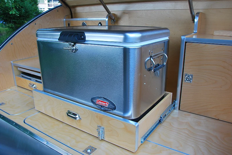 Caron placed the cooler and stove side-by-side so that they don't get in the way of each other, a problem he had with other galley designs