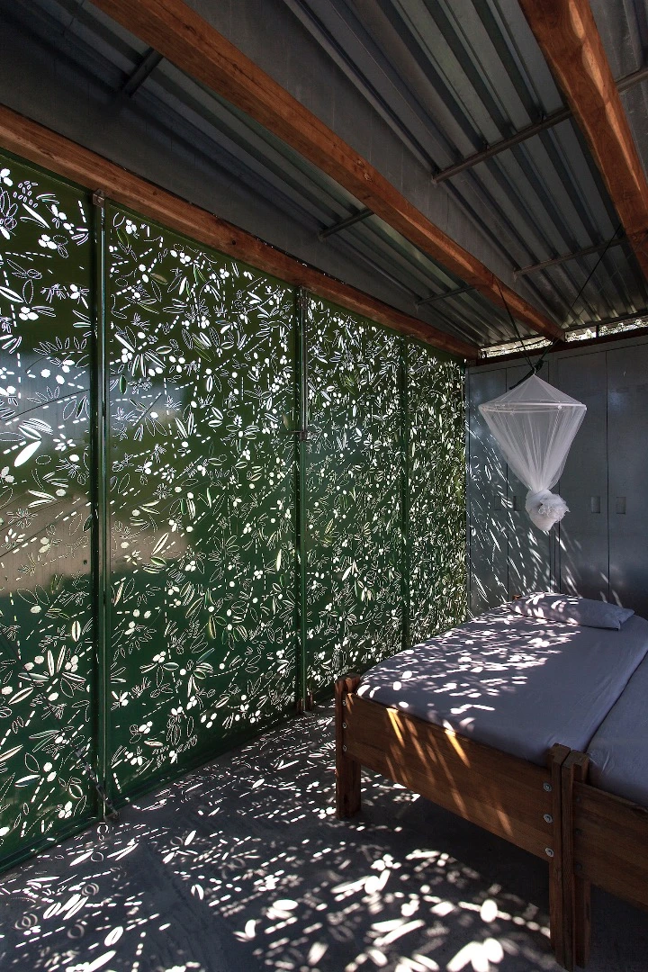 The inspiration behind the Olive Tree House's unusual metal cladding derives from its location next to an olive grove