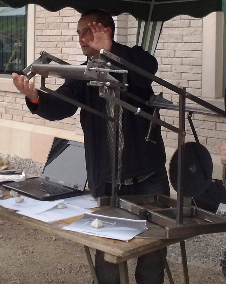 Heath Evdemon demonstrates the reciprocating motion of the new Wind Harvester