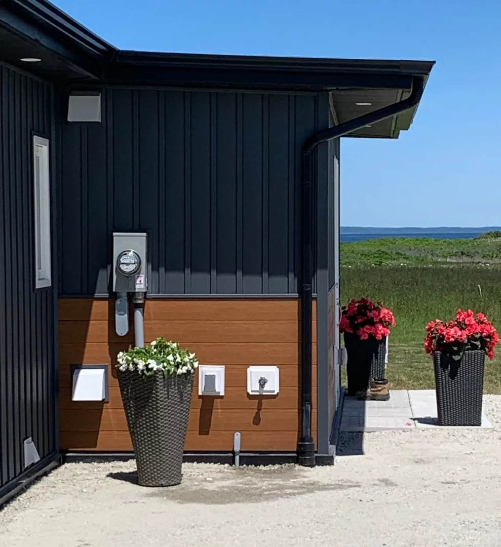 Beach House's walls consist of prefabricated panels that were made by melting down the plastic bottles