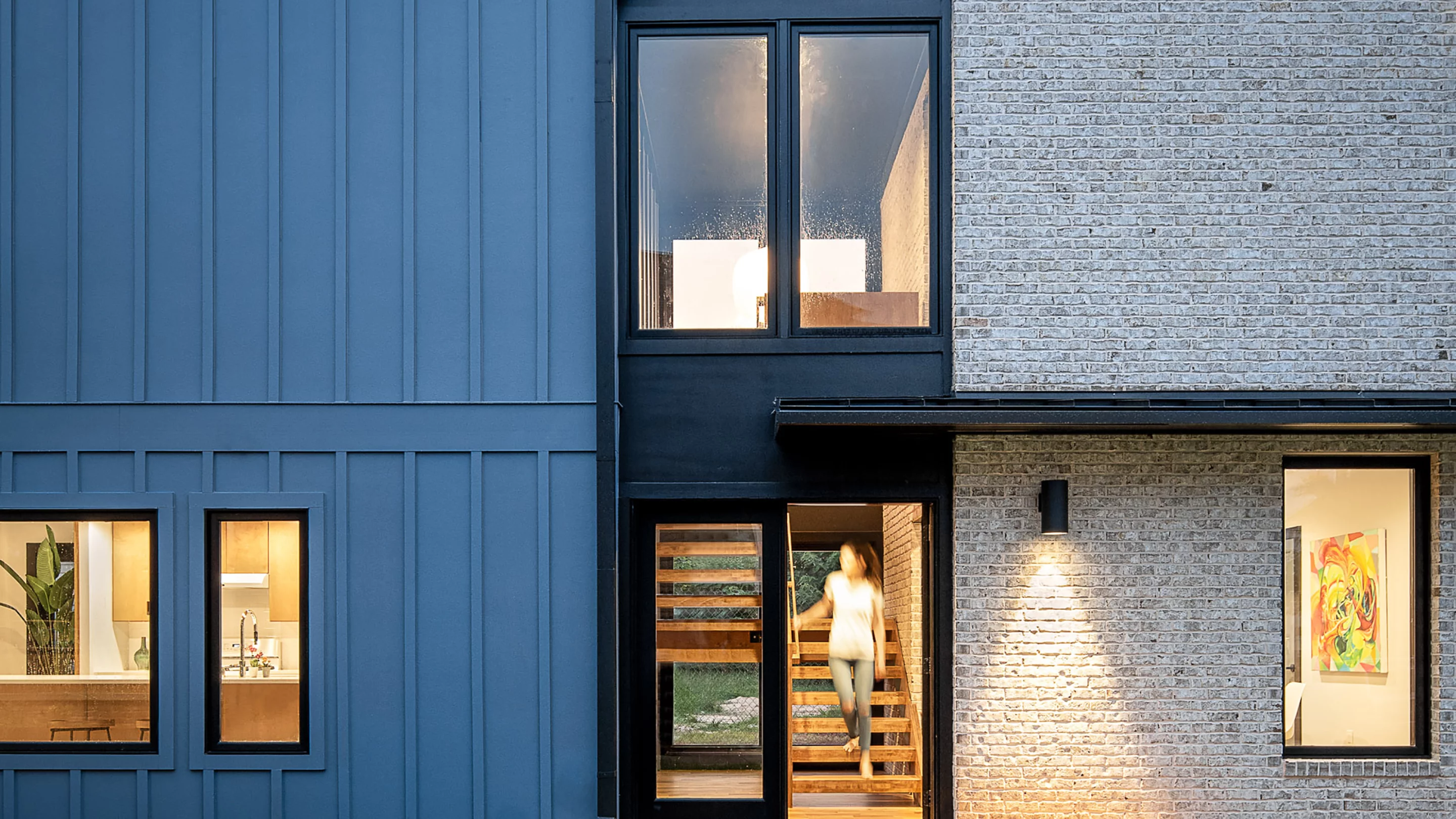 aMews House has a width of just 14 ft (4.2 m), though is much longer. The home is shoehorned into an awkward urban site and features a space-saving interior layout that's arranged vertically