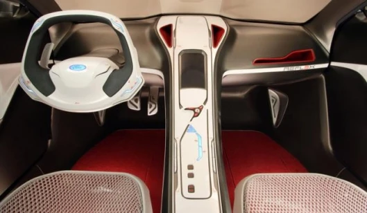 Shift paddles that control the 6-speed semiautomatic transmission are tucked behind the steering wheel, while the touch-screen center console helps reduce driver distraction.