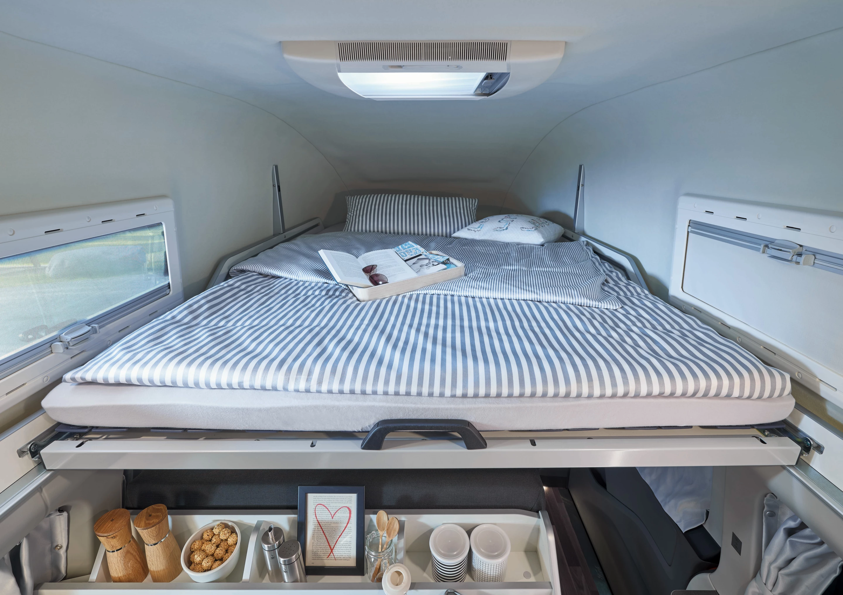 Built to sleep up to four, the Transit Custom Nugget has a double bed in the pop-top and one that folds out in the lounge