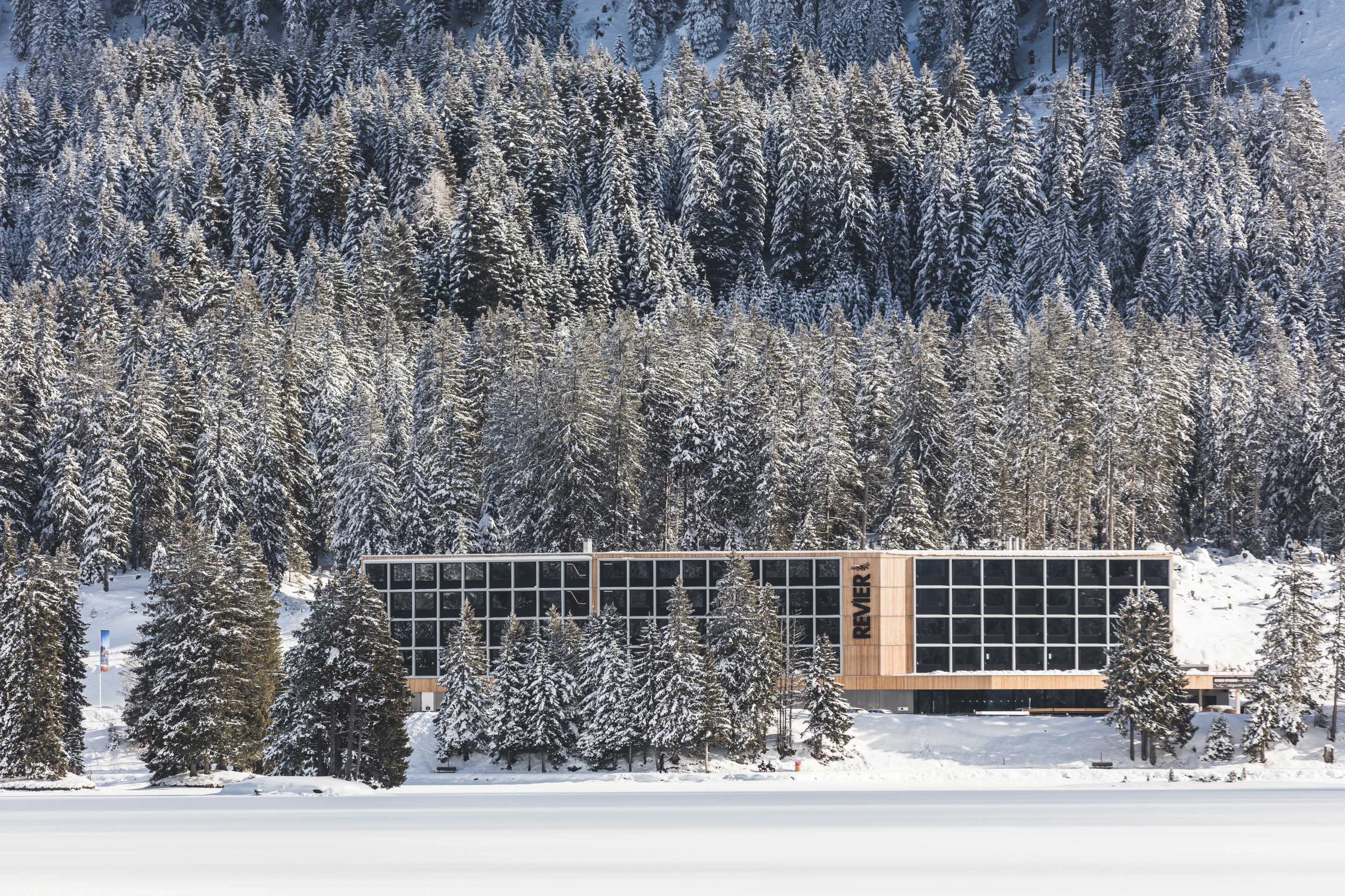 Each of the 96 rooms making up the four floors of the Revier Mountain Lodge was crafted from natural unfinished plywood and fabricated off site