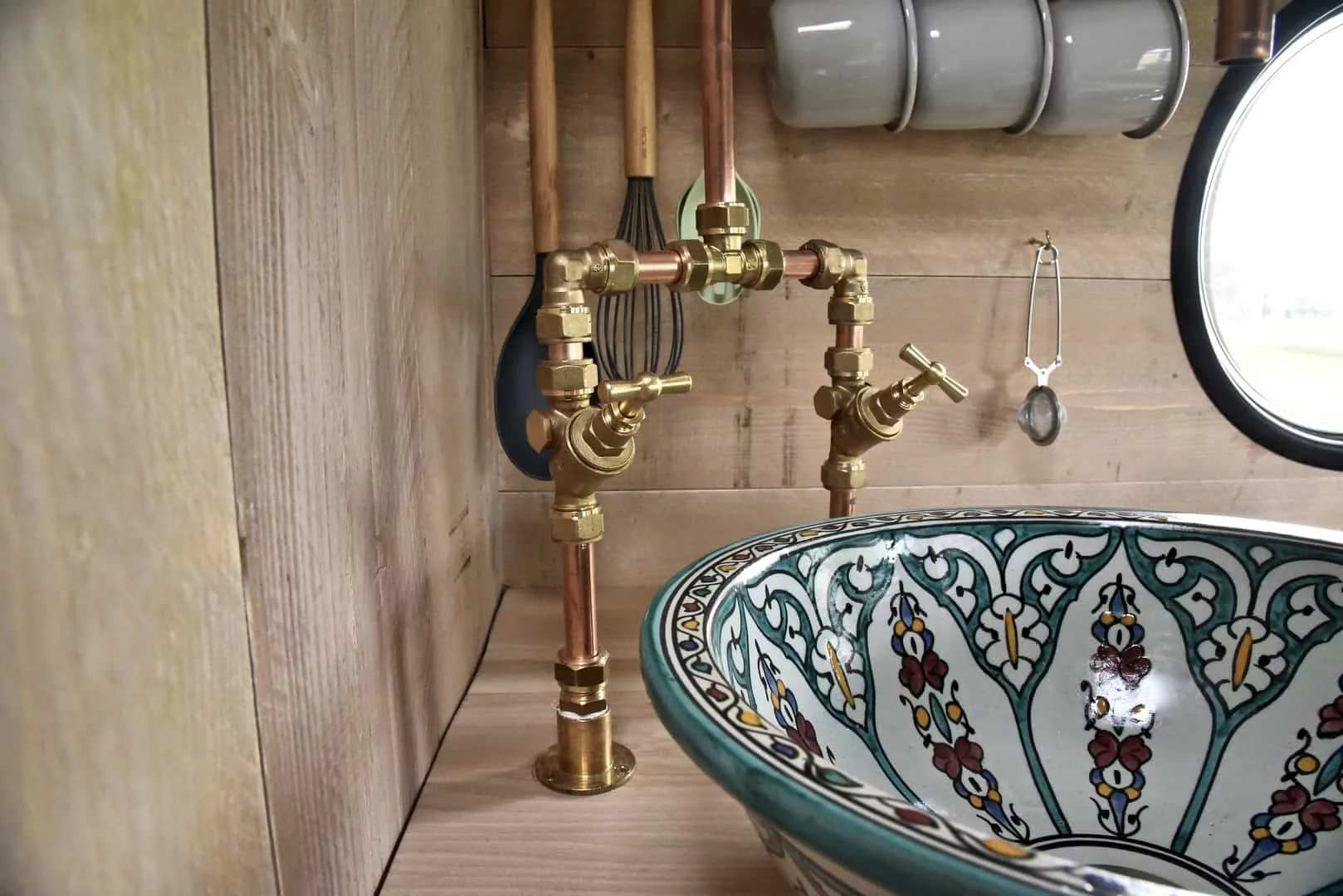CustomCamp tells us the hand-painted sink is originally from Morocco