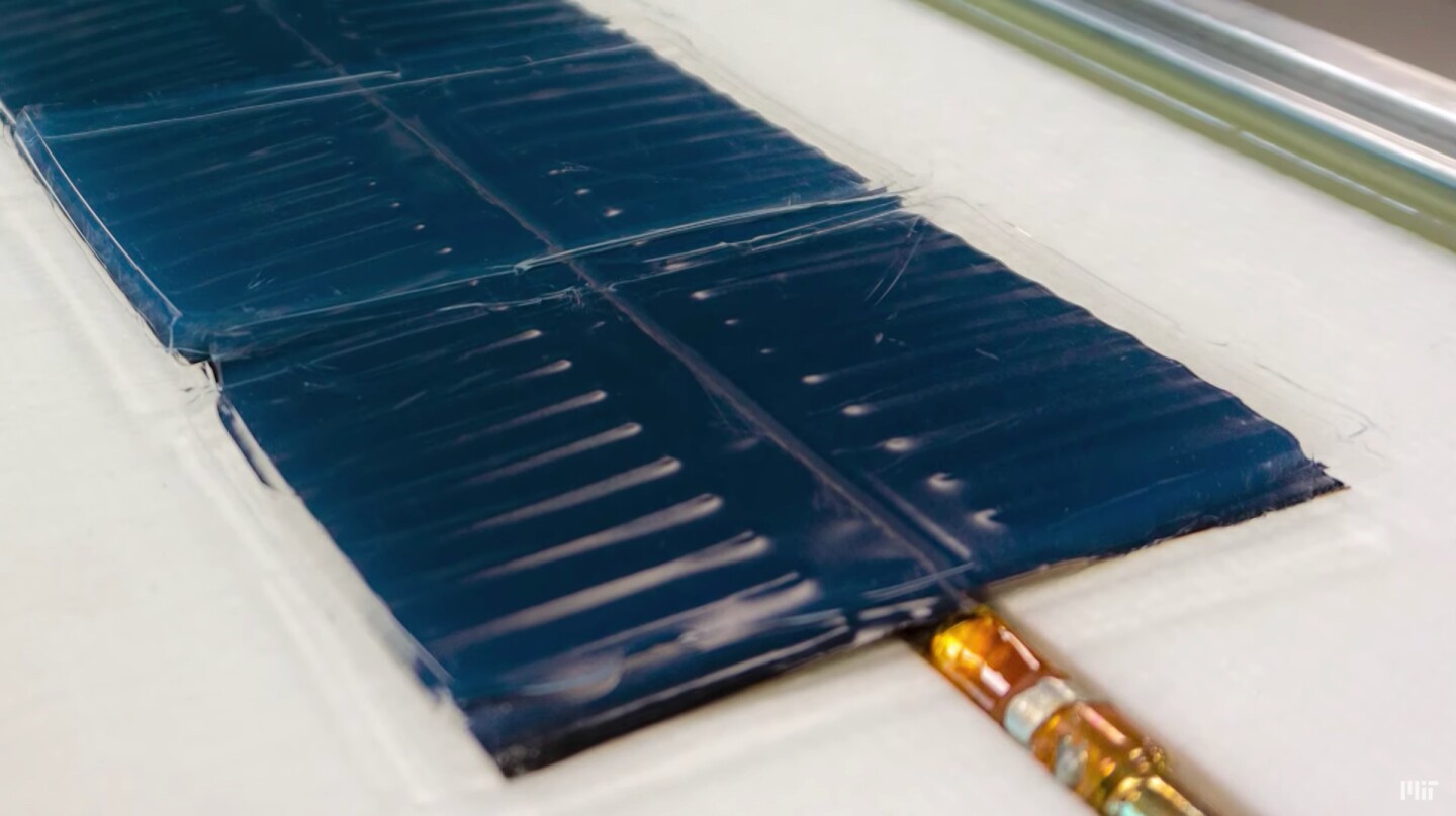 A close look at the aerogel-covered, black-coated copper plate, which heats water contained in pipes on its underside