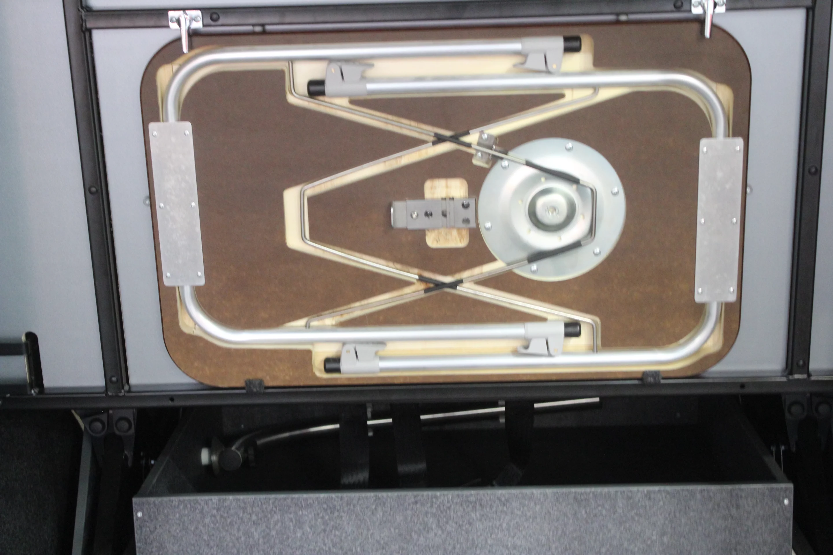 We didn't see matching chairs (perhaps on the lift gate or meant to store in the load area), but the back of the rear bench had a folding table attached