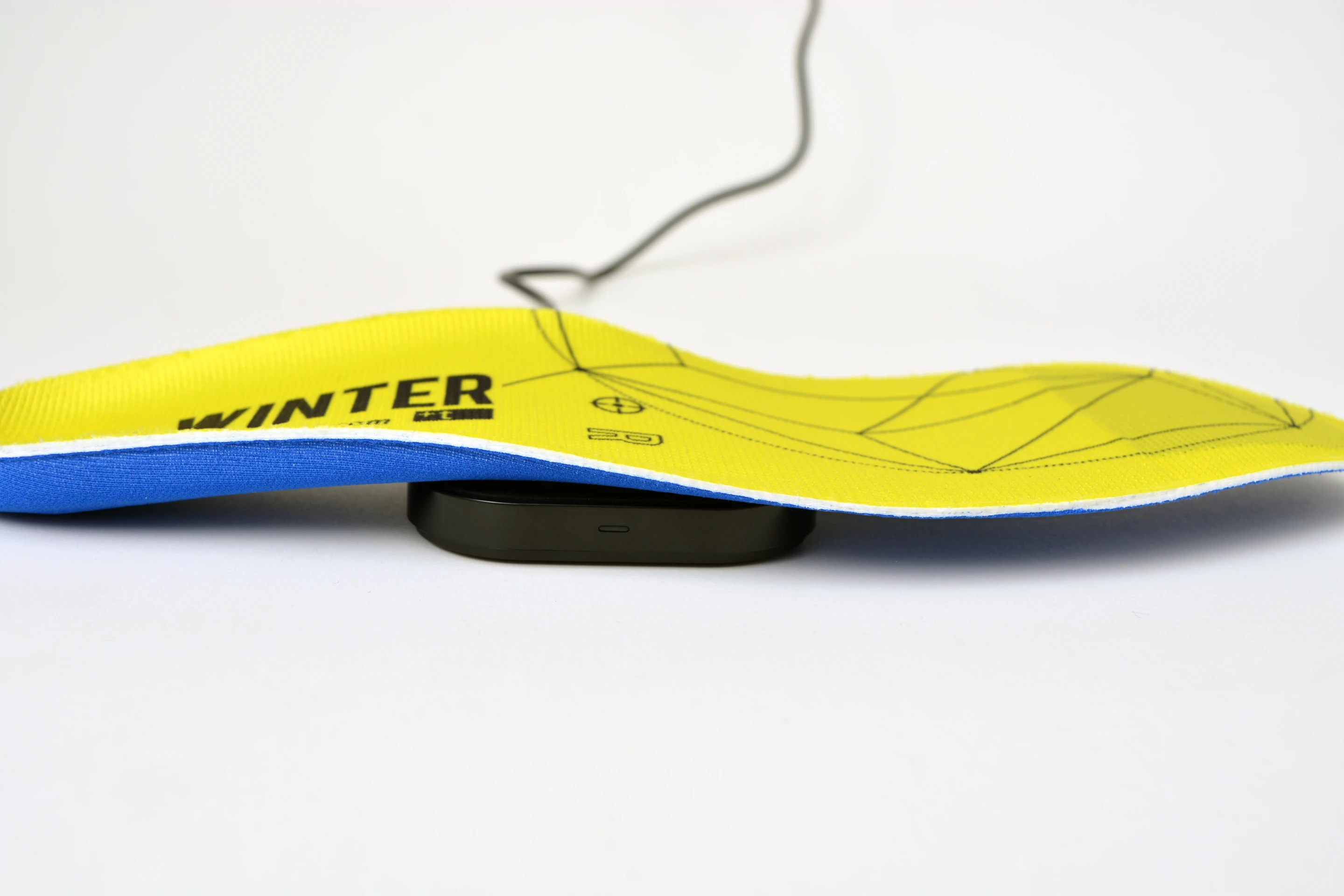 +Winter insoles are juiced up wirelessly using an included charging pad