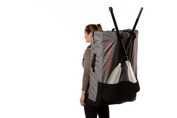 The Oru Bay+ with split paddle and backpack (both sold separately) ready to hike to the water