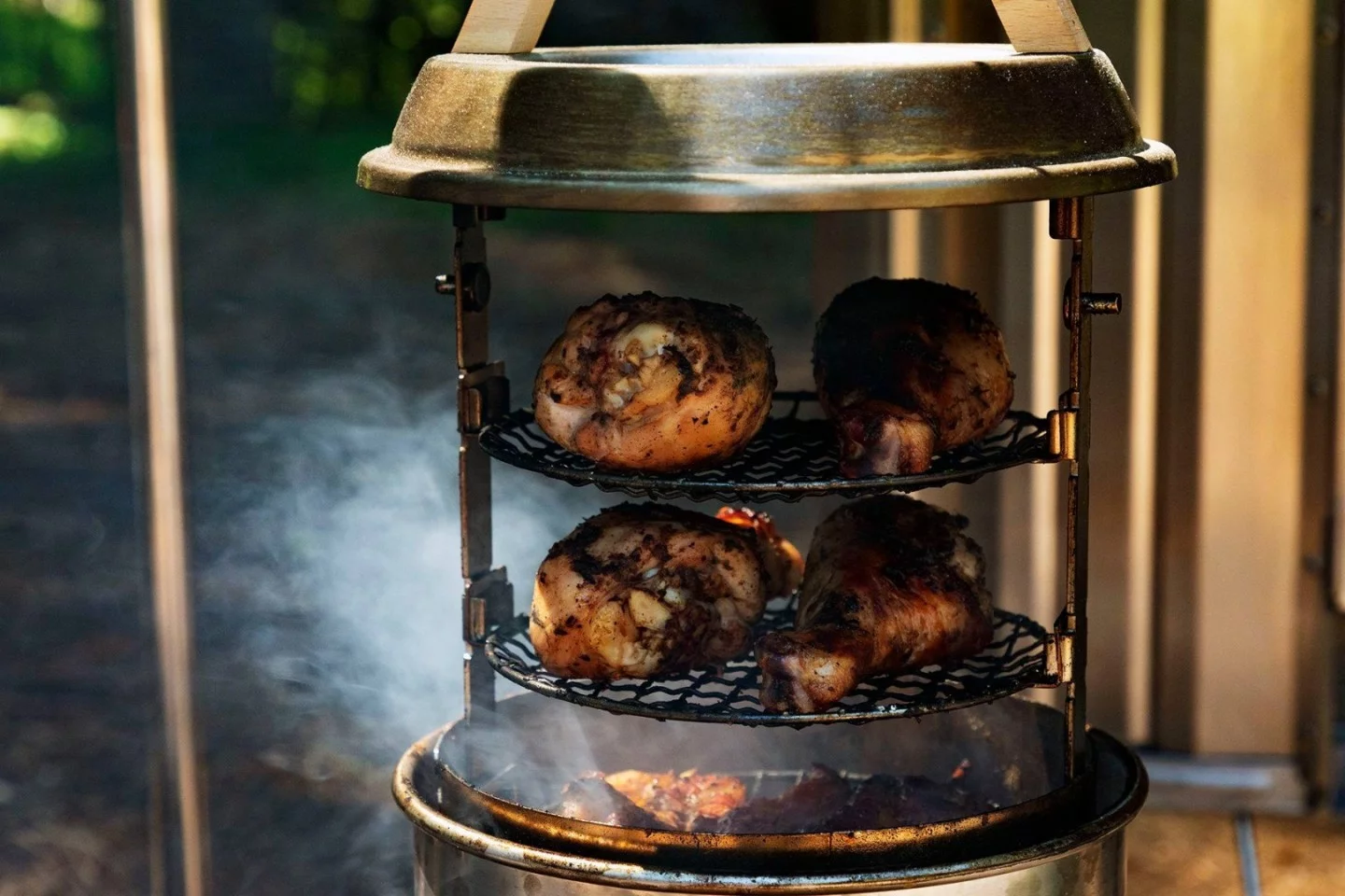 The Snow Peak Smokemeister is a smaller, more portable option for smoking meats and other foods
