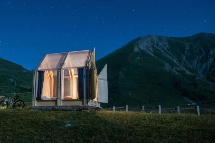 This striking transparent-roof cabin is only 6 square meters (65 sq ft) large and is currently being used as a unique glamping experience in the Italian Alps