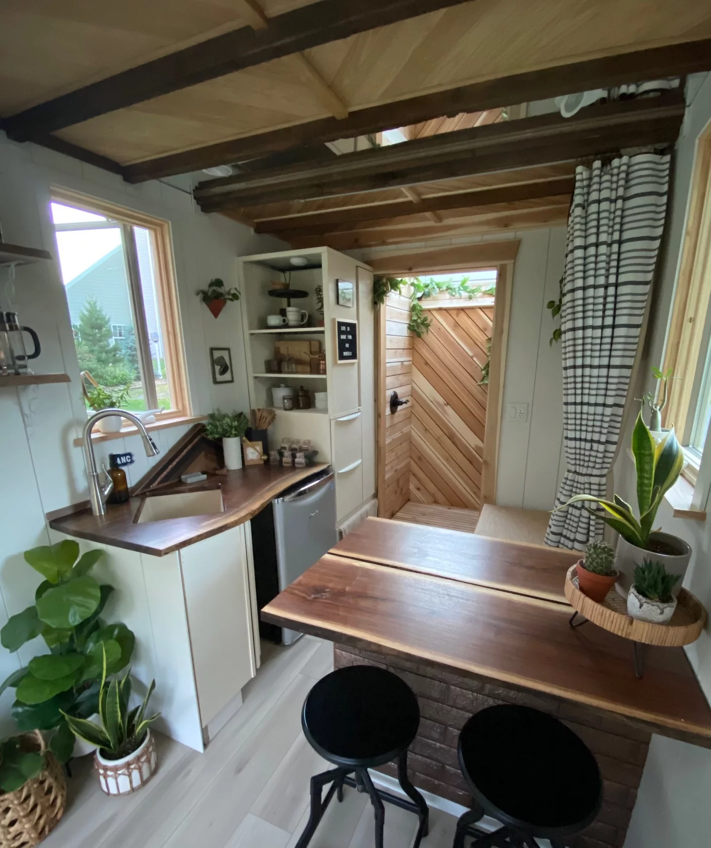 The kitchen and dining zones lead through to the showcase cedar shower