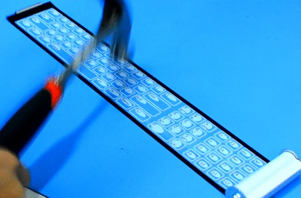 Since all the electronic components are printed flat and made of water and dirt resistant materials, the keyboard can survive drink spills and even being hit with a hammer