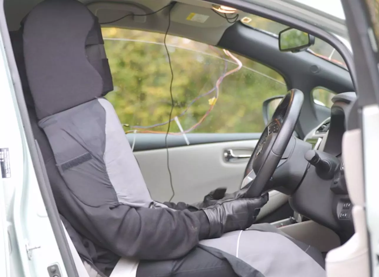 A researcher in the driver seat wore a "seat suit" so that pedestrians would believe the Nissan Leaf test car to be an autonomous vehicle