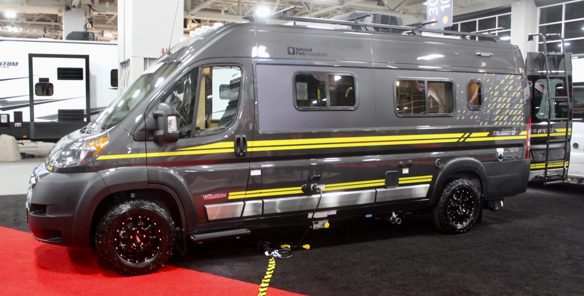 We don't always love bright yellow on vehicles, but we think it blends nicely atop the National Park Travato's gray paint – the grippy all-terrain tires don't hurt the look, either