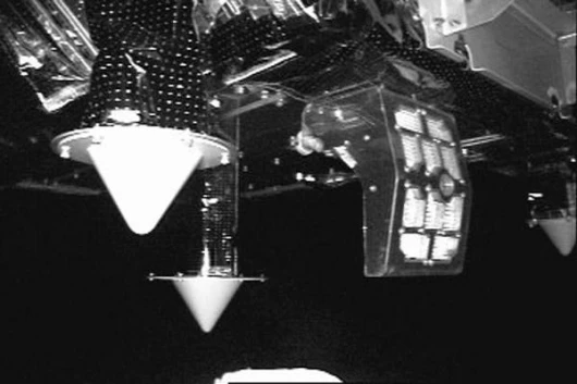 This is a view of the Integrated Light Assembly (ILA) and two of the ASTRO antennas. The ILA is made by MDA of Canada and will illuminate the NextSat during approach. In the upper right of the picture a corner of ARCSS sensor cover can be seen. This cover