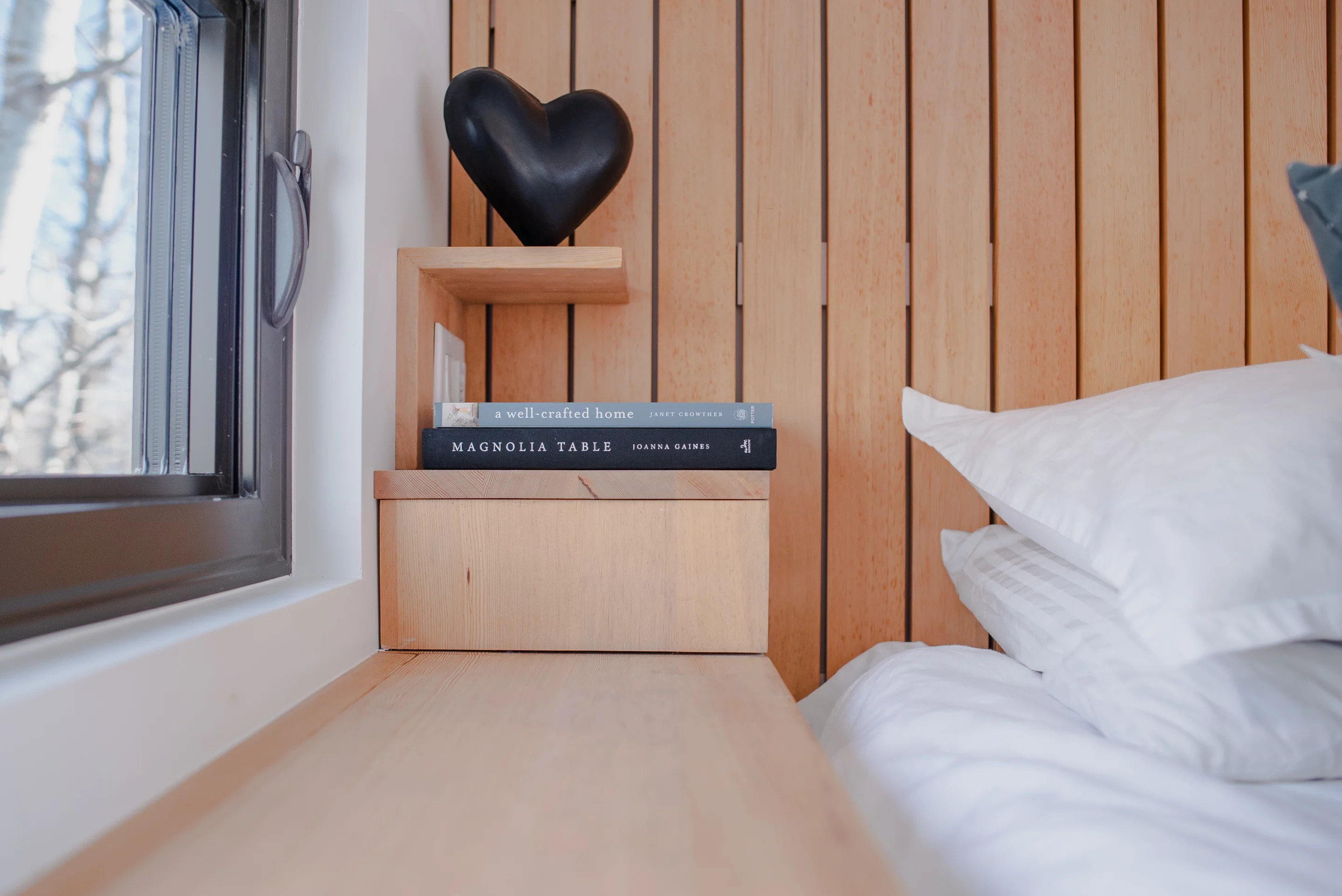 Hidden storage and elegant features stand out in the loft bedroom