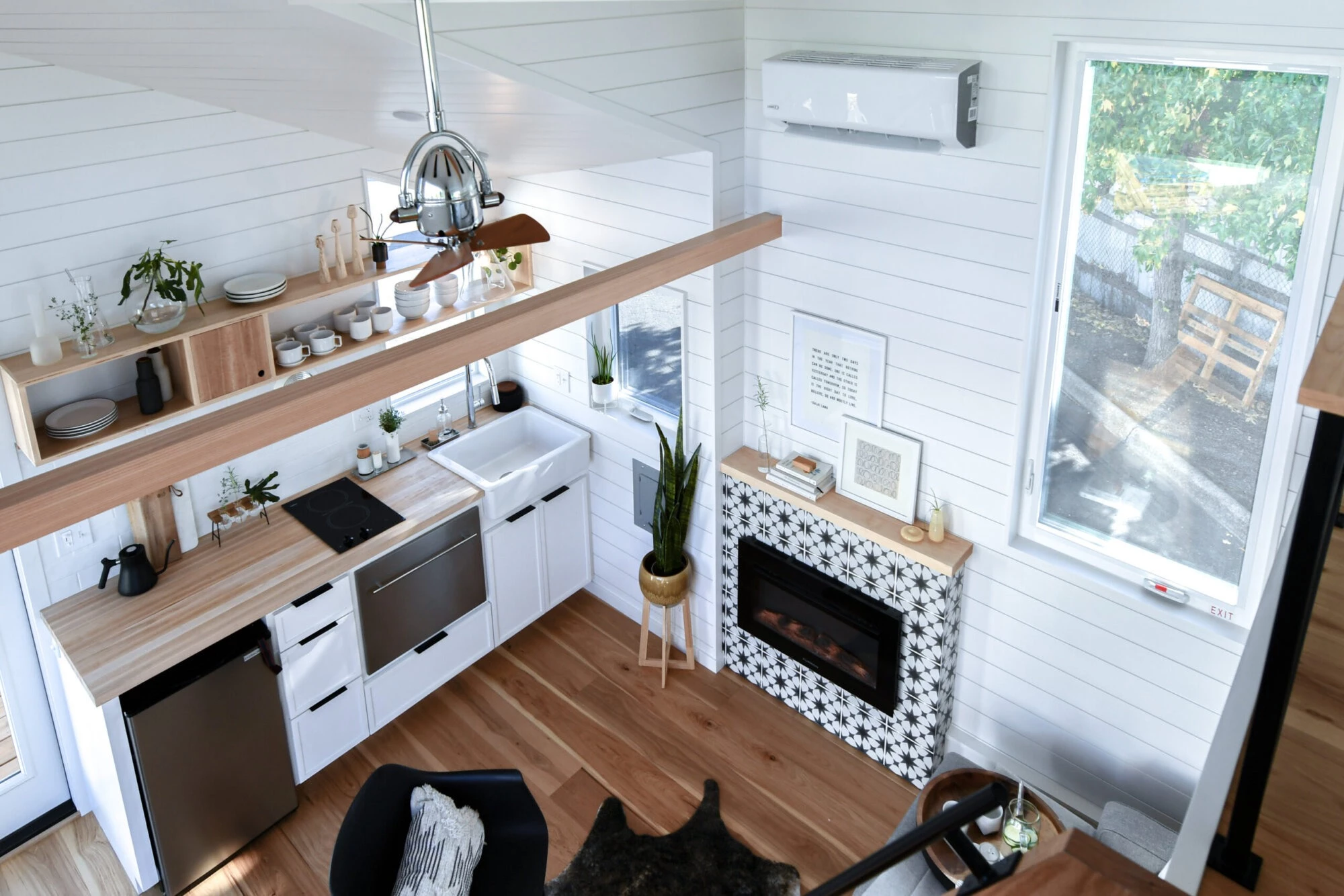 The Urban Park Studio's interior is kept a comfortable temperature with an electric fireplace and a mini-split air-conditioning unit