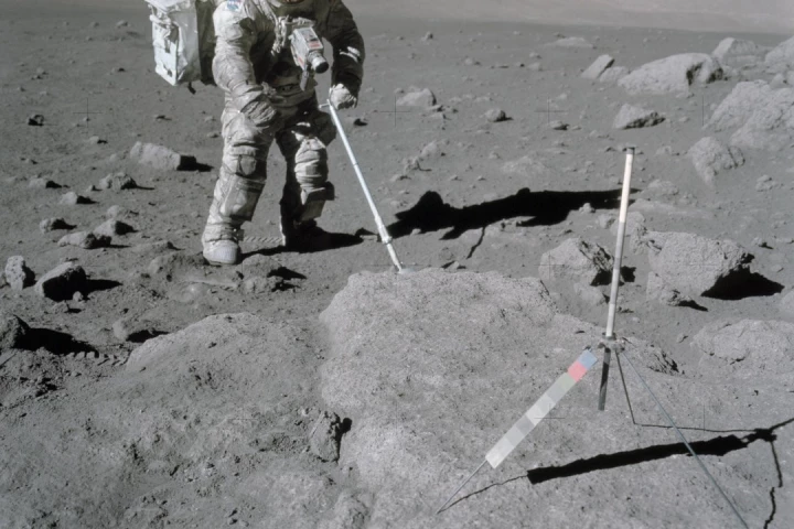 NASA astronaut Harrison Schmitt retrieves lunar samples