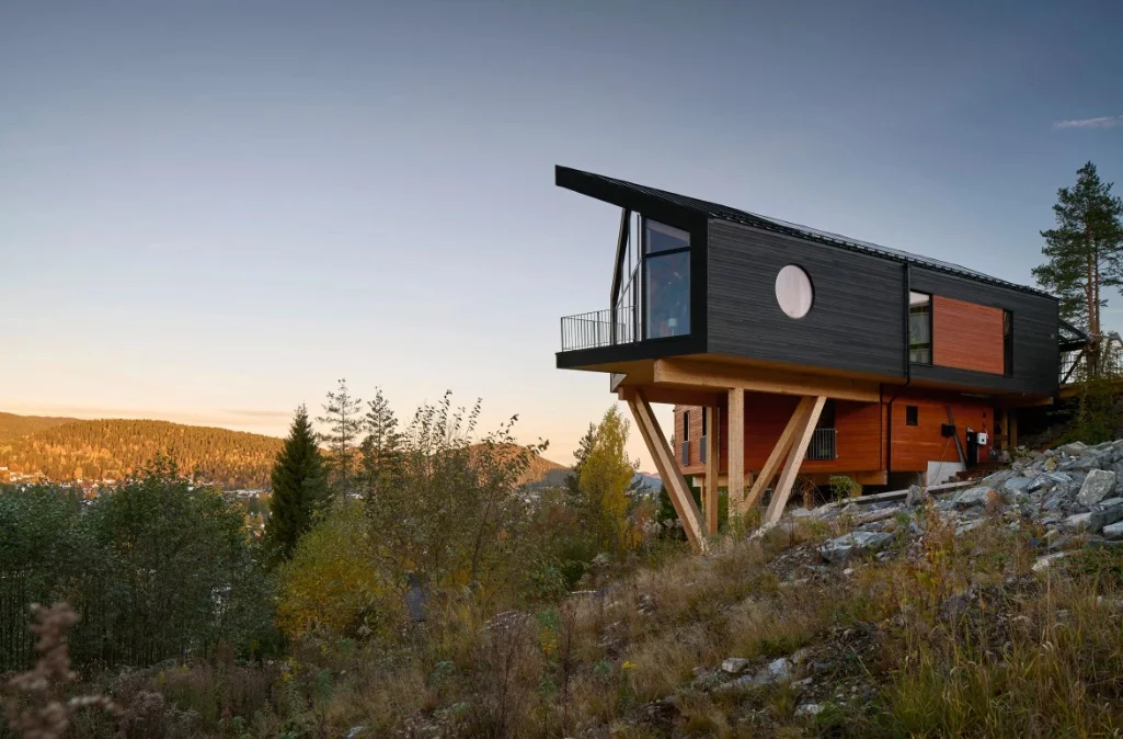 House Dokka is a single-family house that is inspired by treehouse architecture and embraces a connection with nature