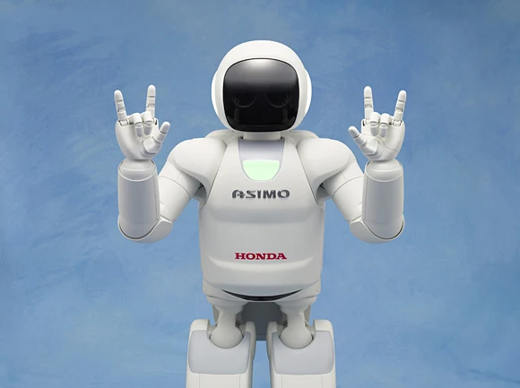 The new ASIMO making the Japanese sign language symbol for "I love you"