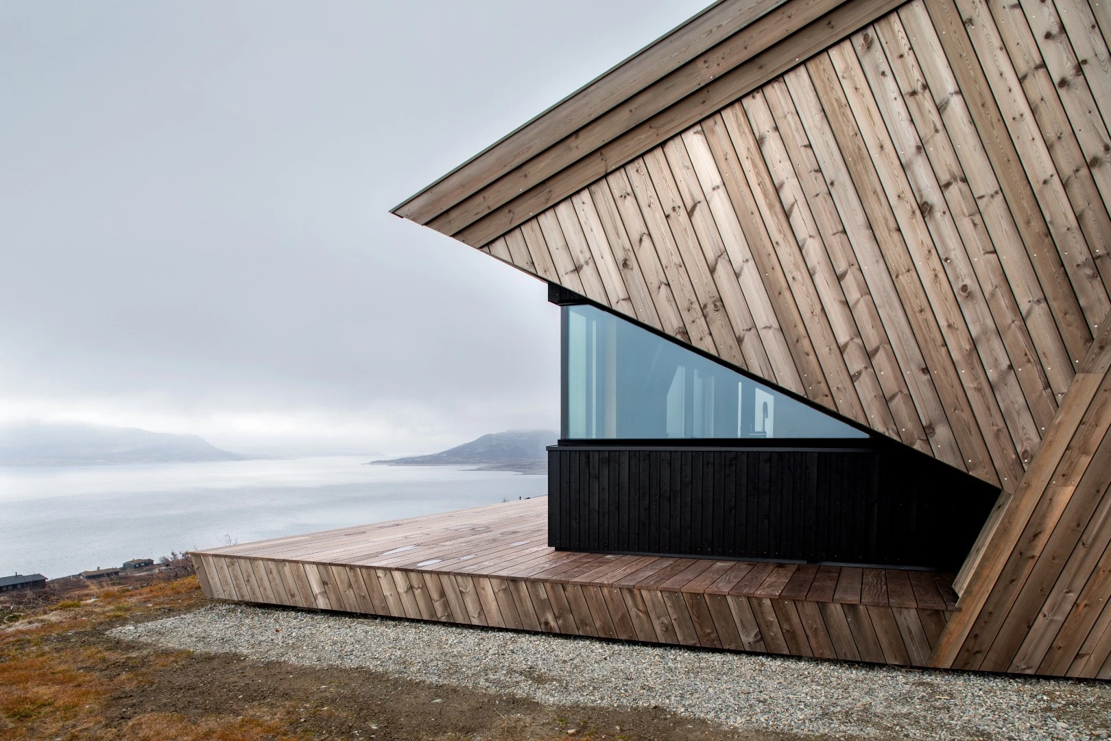 The Hooded Cabin's eye-catching roof is finished in ore-pine, which was once used to create Scandinavian Stave Churches and should stand the test of time