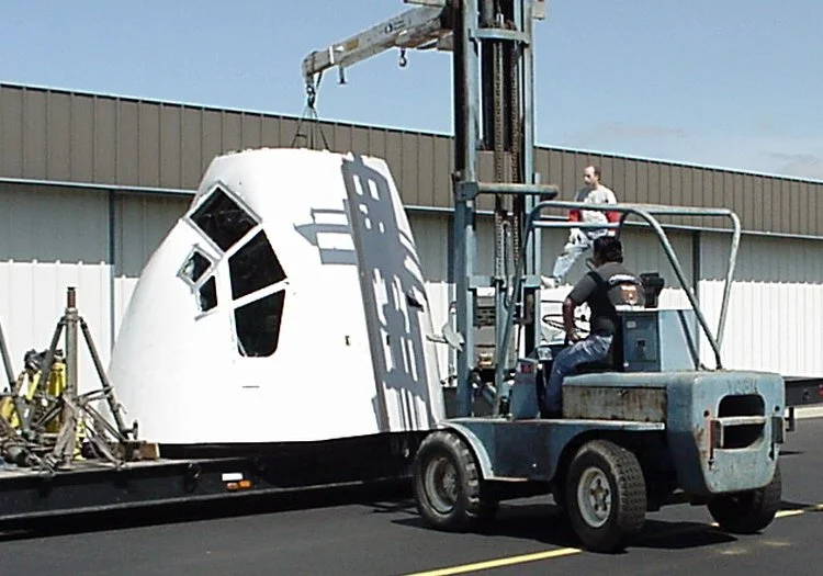 Price takes delivery of the 2,500-pound nose section in June 2000