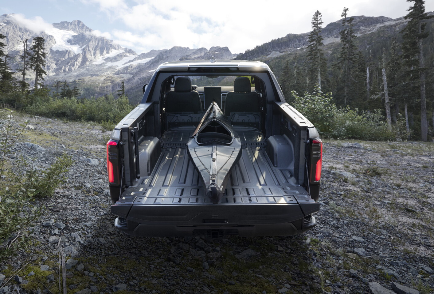 With its MultiPro Midgate and MultiPro Tailgate, the Sierra EV's bed expands from just under 6 feet to just under 11 feet, carrying oversized gear like kayaks, canoes or surfboards