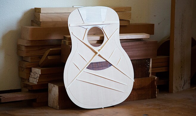 The traditional X-brace design has been used in acoustic guitar making for over 100 years