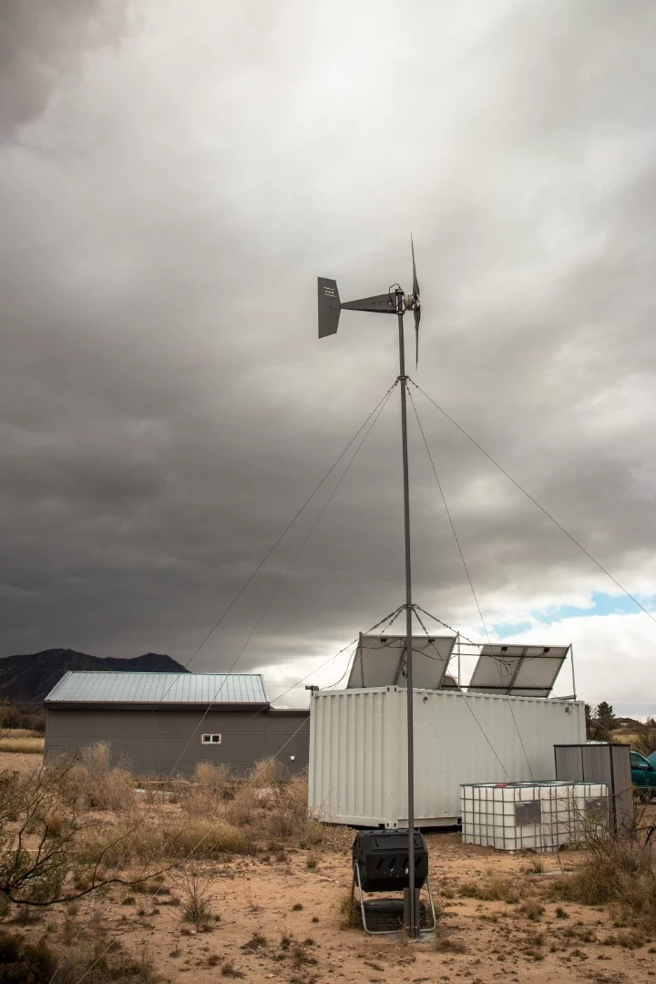 Chris erected this 1600 watt Missouri Freedom Wind Turbine by himself. He enlisted the help of an ATV tow winch that he welded to the top of his shipping container.