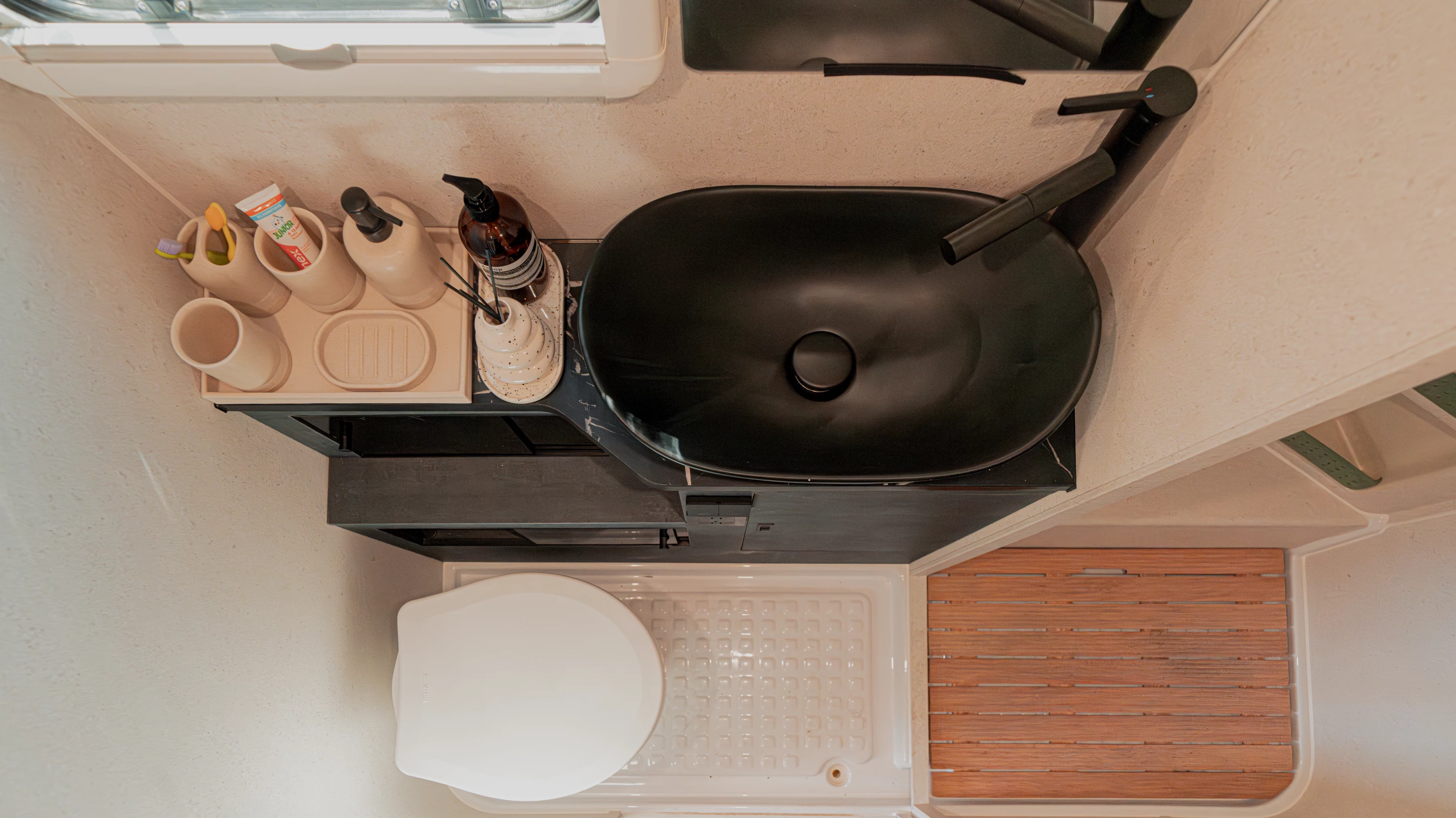 The dry bathroom includes separate shower and toilet/sink compartments