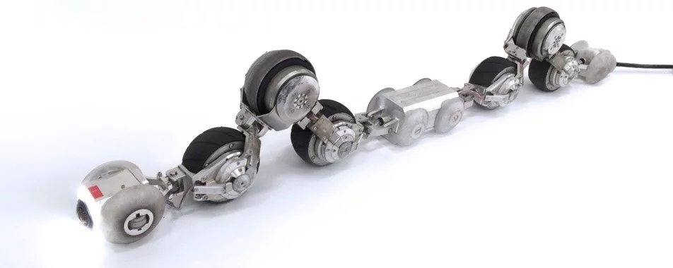 Depending on what's required, THESBOT takes on a sort of zig-zag shape, so that only certain dedicated wheels make contact with the pipe walls