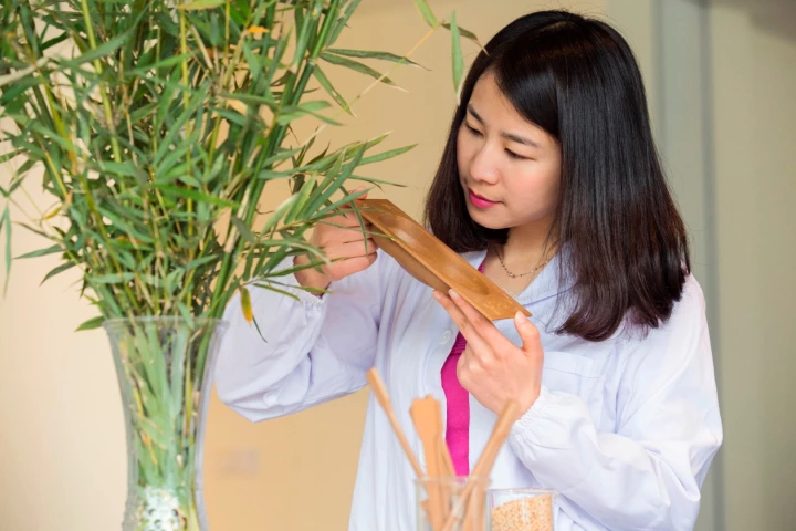 Janet Yin, a materials engineering supervisor at Ford’s Nanjing Research & Engineering Centre, with a bamboo-based car part