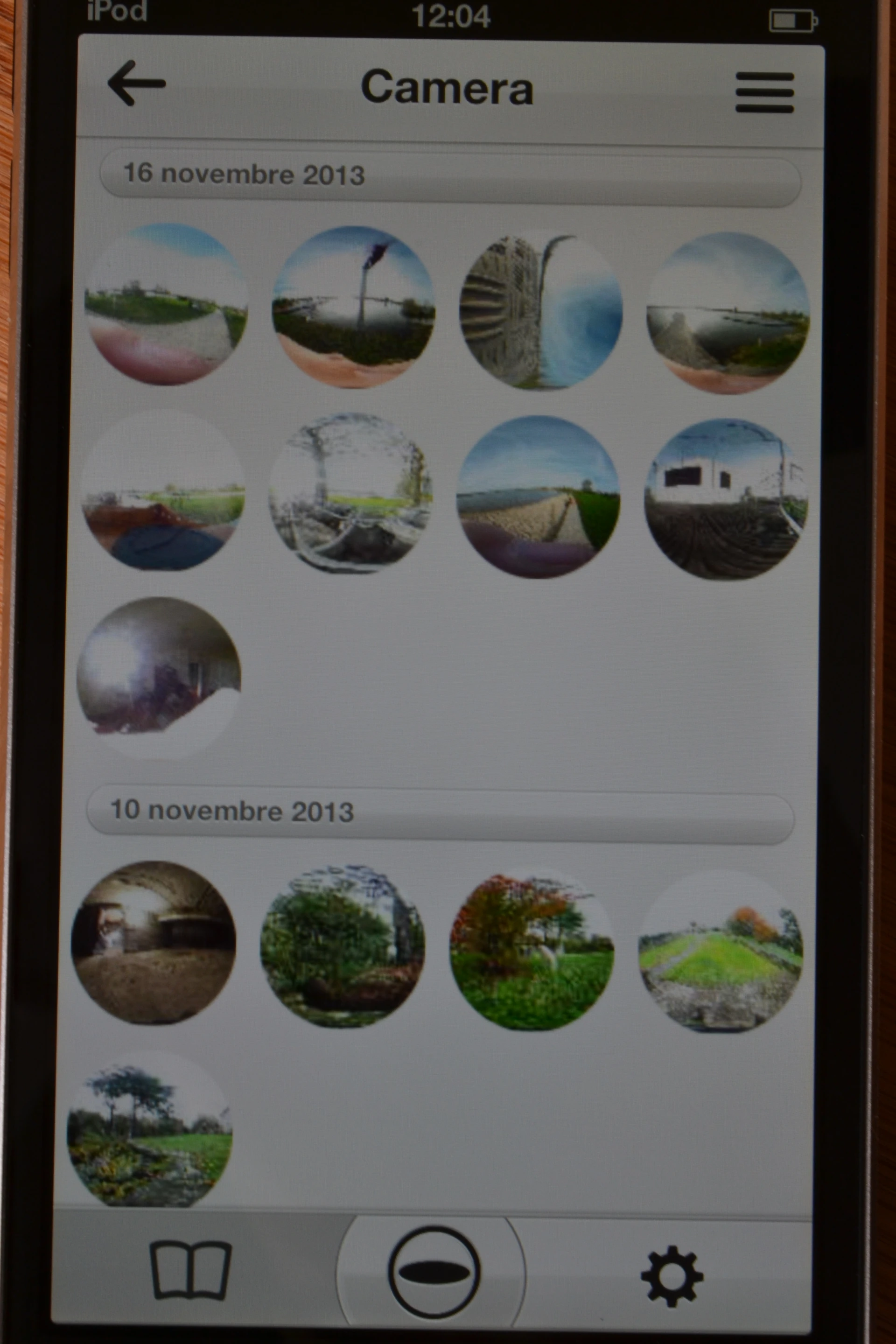 The app's main menu screen shows a link to photos taken using the app, and one to photos stored in the camera's internal memory