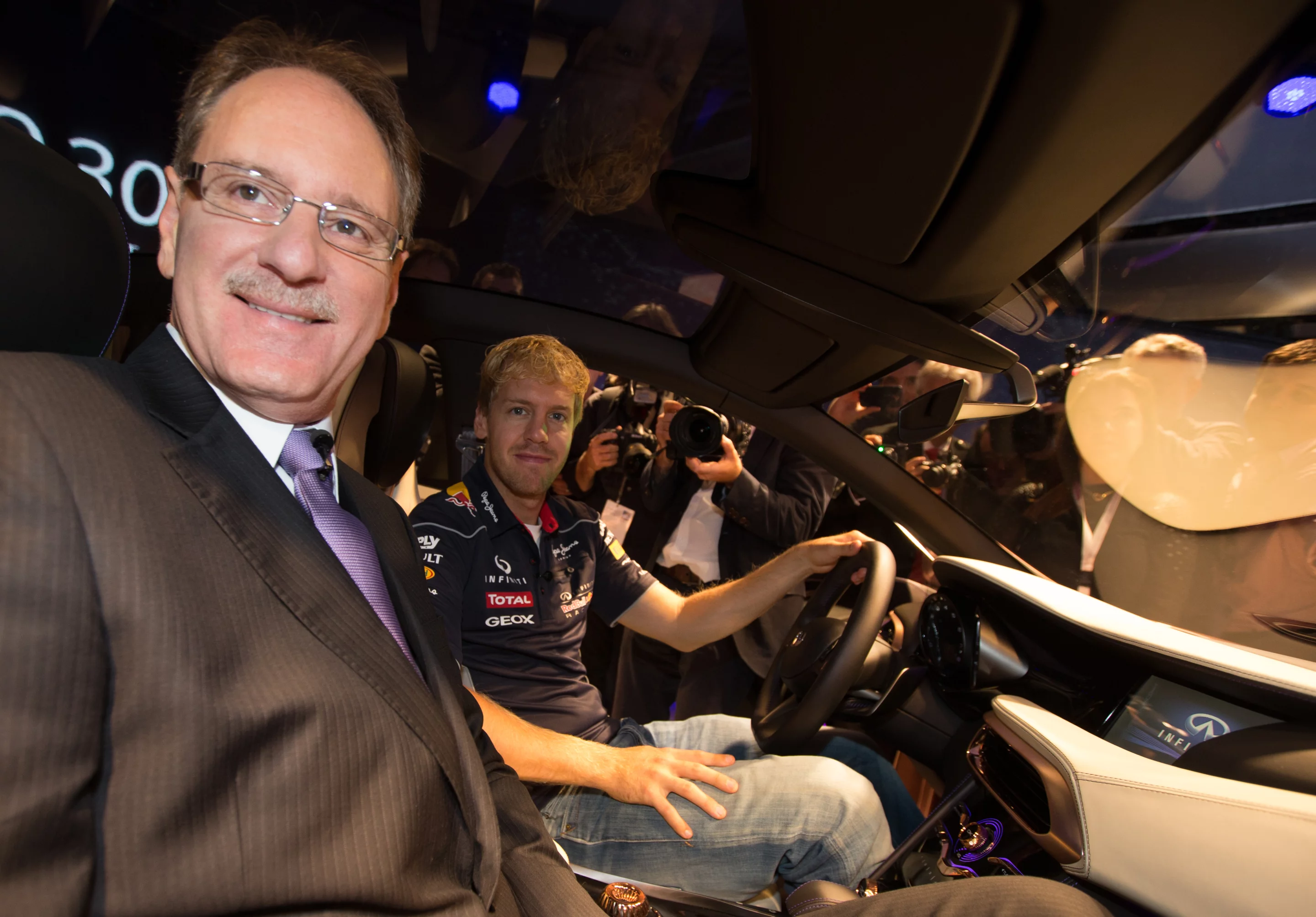 The metallic gold delivery and a promotional drop-in from Formula One champ Sebastien Vettel will doubtless enhance the car's prestige