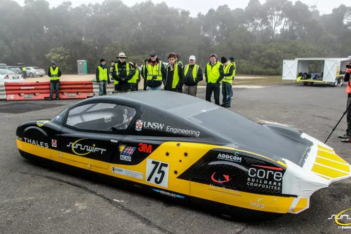 Members of the Sunswift team and the eVe after it's record-breaking run (Photo: Sunswift / Daniel Chen)
