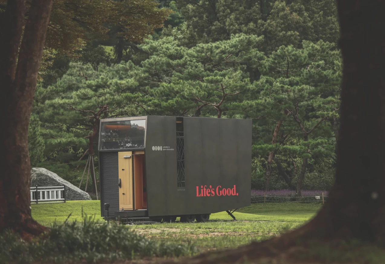 LG used a similar half-glass, half-entryway split on the original 2023 Bon Voyage, albeit on the front side of the longer, taller tiny home with two floors