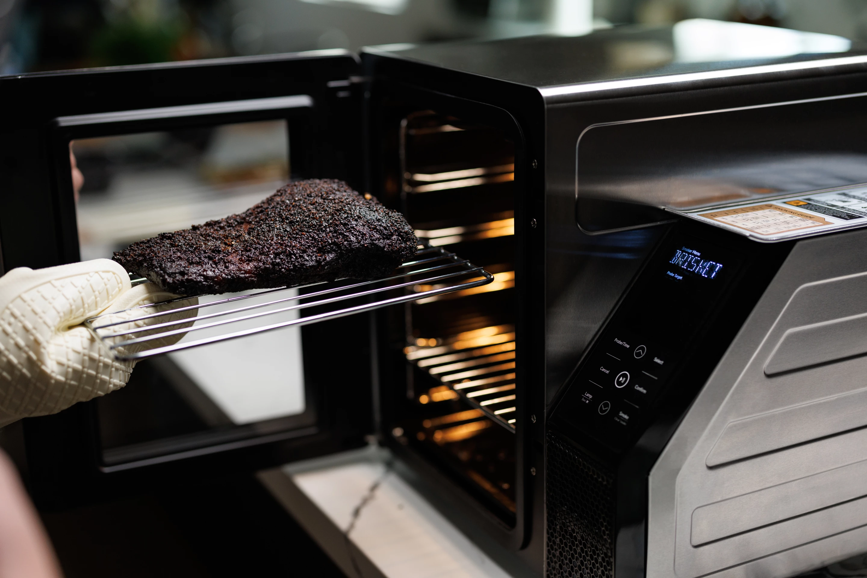 SmoqeX features four grilling racks