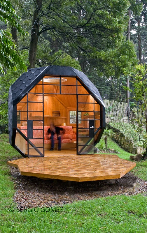 The front deck appears as it has peeled away from the main structure, giving rise to the pod’s large open frontage
