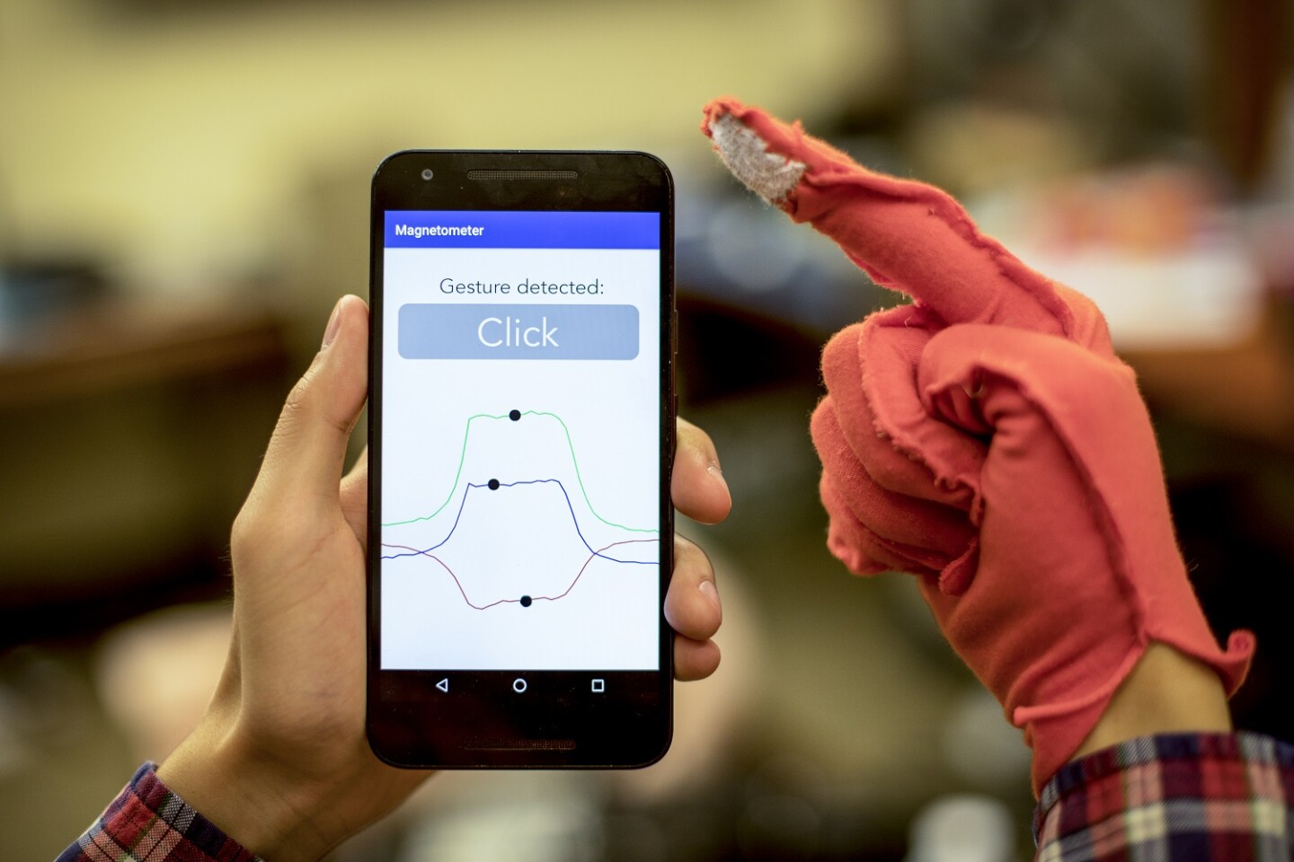 By embedding patches of the magnetic fabric into the fingertips of gloves, the team showed that a phone's magnetometer could read gestures