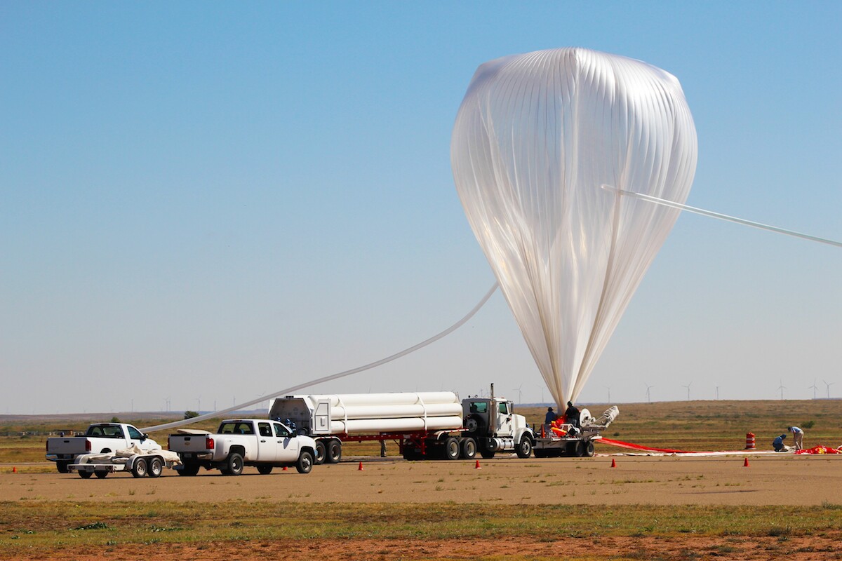 A team prepares the E-MIST balloon for takeoff, during tests in October 2015