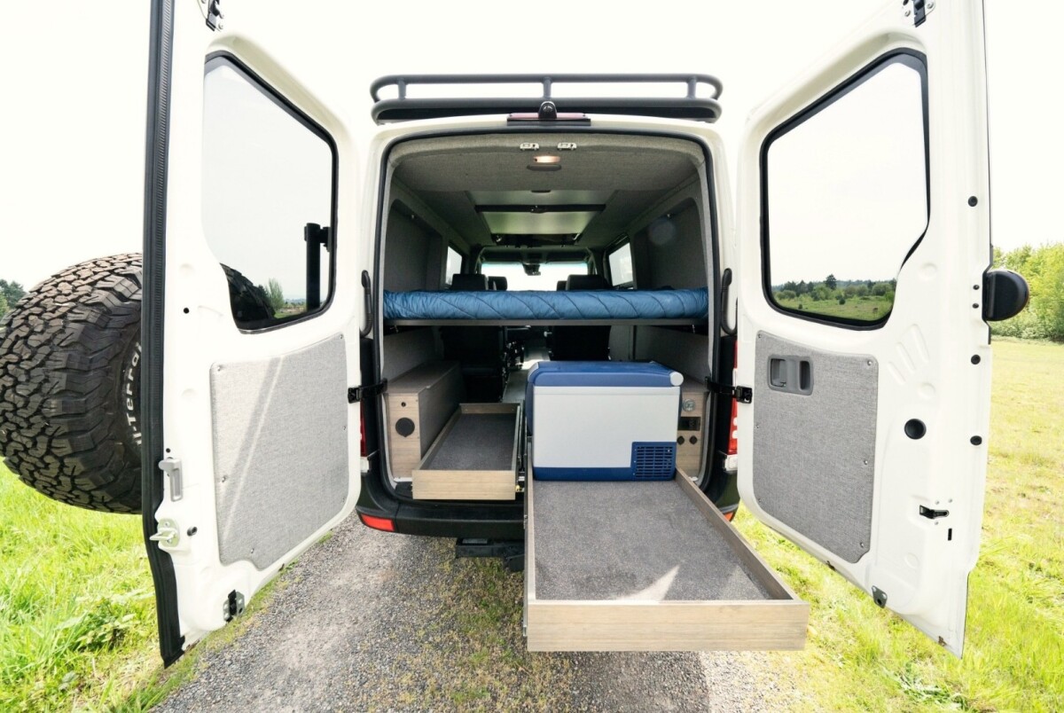 The ARB fridge is the only thing helping to fill out the large 48-in (122-cm) storage slides, which are sized to fit popular Front Runner storage boxes