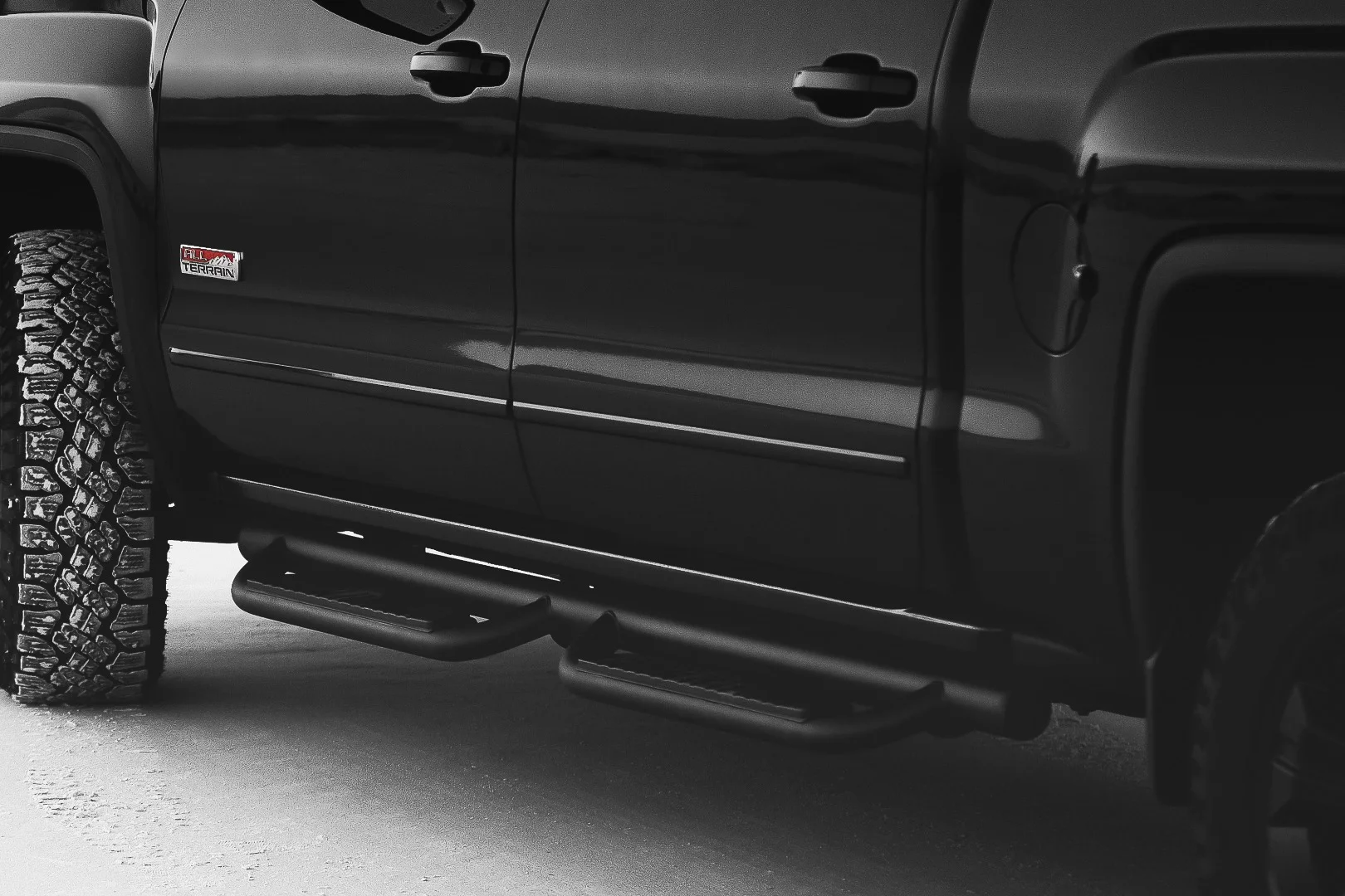 The blacked side rails and body-color door handles are part of the X package