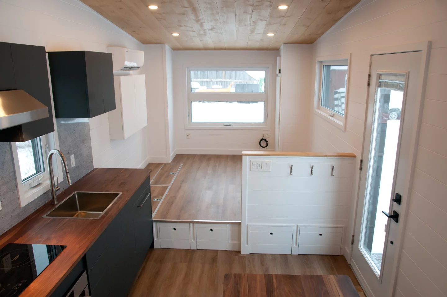 The Noyer XL's living room is raised a little, creating storage space below