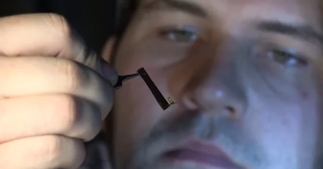 PhD student Christopher Pateman with one of the NGCs (tiny yellow object at center) (Photo: University of Sheffield)